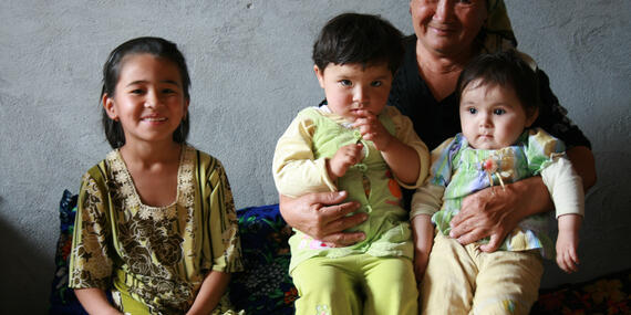 A central Asian family sit together
