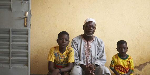 Dahani Adama with his children in a house where they found a shelter in Fada,