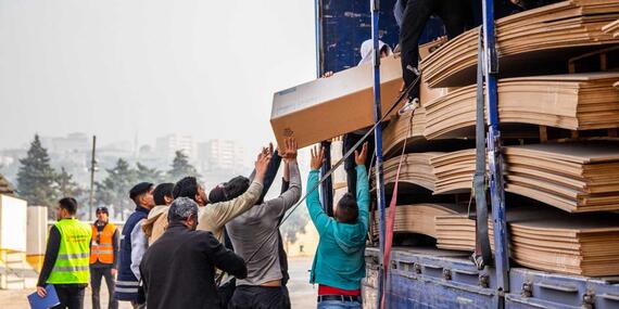 Wood being loaded onto trucks in north-west Syria