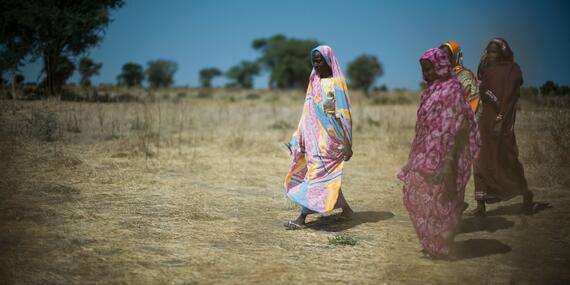 Women walking through a field