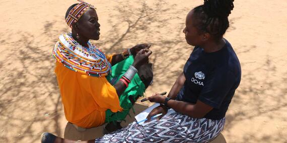 OCHA staff member, Jane Kiiru, interviews one of the founders of Umoja village.