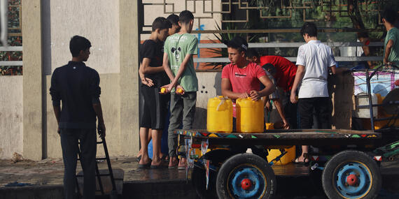 People collect water in Khan Younis city, southern Gaza Strip, amid escalating hostilities. Most of the Gaza Strip’s water systems are heavily impacted and/or non-operational due to the security situation, a lack of fuel, and damage to production, treatment and distribution infrastructure.