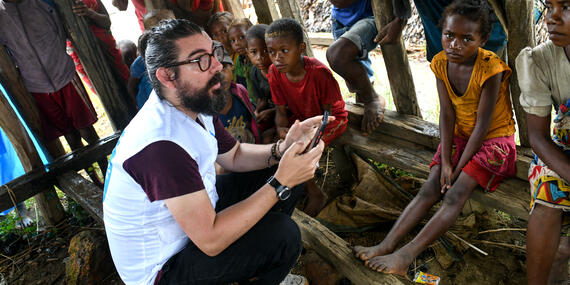 An aid worker listens to residents of Ambalakondro region who were affected by Cyclone Freddy