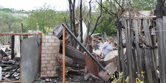 Ukraine Kharkiv residents clear the debris after their homes were destroyed in an overnight attack.