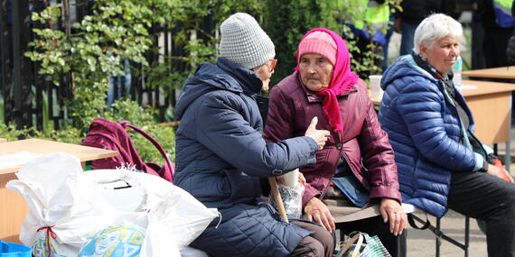 Two women evacuees from the front-line communities in Kharkiv Region at the transit centre for displaced people in Kharkiv city. May 2024. Photo: OCHA/Tanya Lyubimova