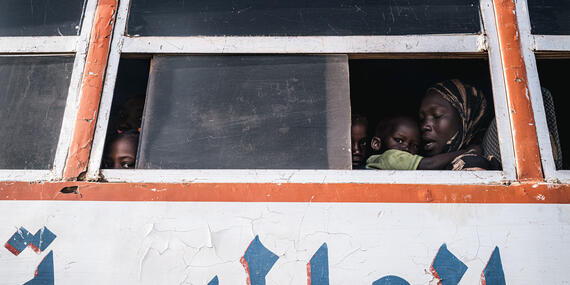 Children, women and men flee the conflict in Sudan in a bus headed for Maban, South Sudan.