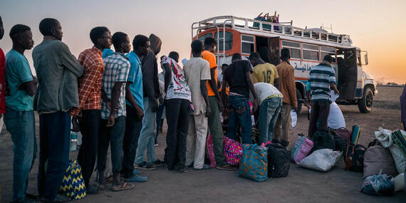 Refugees and returnees from Sudan wait to board a truck to Maban, South Sudan.