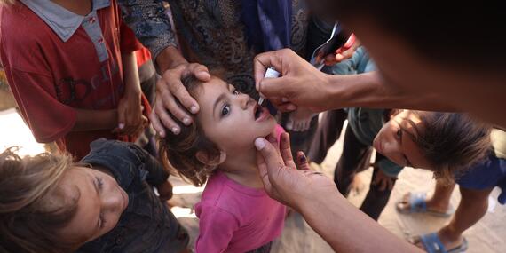 Health workers administer polio vaccines in Gaza