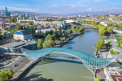Aerial view of the Tbilisi skyline and the Kura river