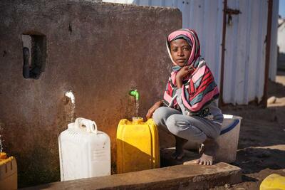 Eleven-year-old Hayat at a water distribution point in Al Rebat camp for internally displaced people in Lahj, Yemen