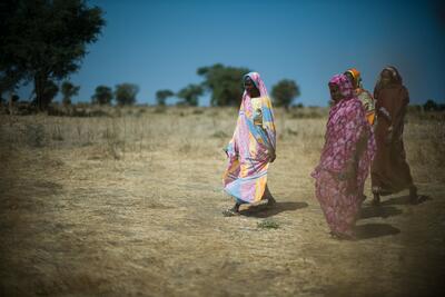 Women walking through a field