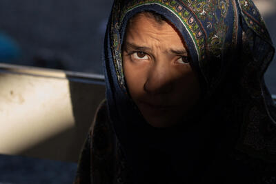 An Afghan woman gazing into the camera, Afghanistan