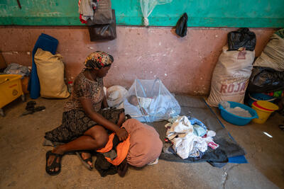A displaced mother with her baby in a former school in downtown Port au Prince, Haiti.