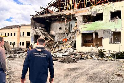 UN staff inspect damaged residential areas in Synelnykovo, Ukraine, after an attack left civilians, including children, injured and civilian infrastructure compromised.