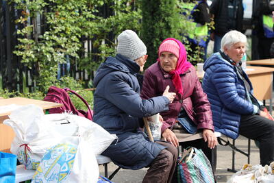 Two women evacuees from the front-line communities in Kharkiv Region at the transit centre for displaced people in Kharkiv city. May 2024. Photo: OCHA/Tanya Lyubimova