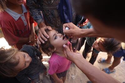 Health workers administer polio vaccines in Gaza