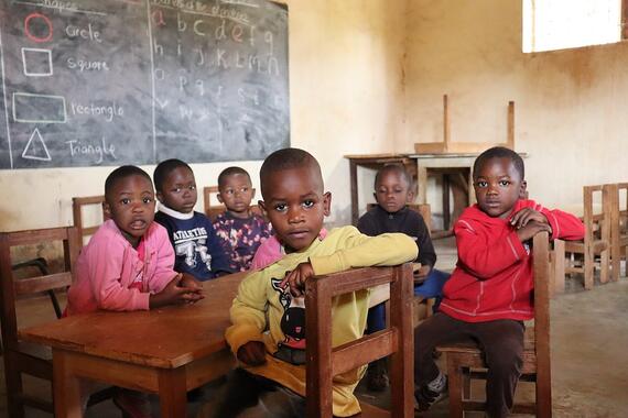 Children sit at a school desk