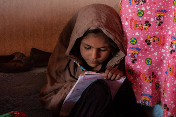 A girl in a child-friendly space for girls that offers educational and recreational activities, Afghanistan.