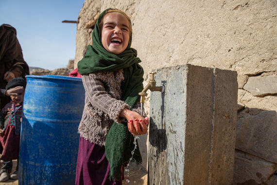 A young girl benefits from one of the water-related projects for Badghis and Herat Provinces in Afghanistan