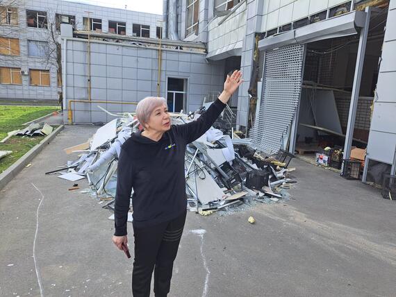 Nadiia shows the damage to the collective centre following the overnight attack on 2 April 2024. Dnipro, Ukraine