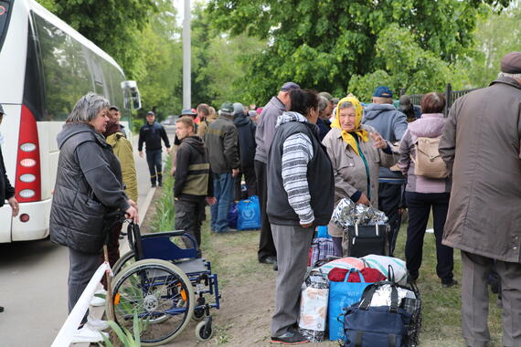 A bus with 50 people onboard arrives at a transit centre for displaced people in Kharkiv from northern communities near the Russian Federation border.