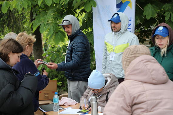 Humanitarians distribute essential supplies to evacuees at a transit centre in Kharkiv, Ukraine.