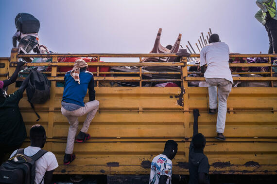 Refugees and returnees from Sudan huddle on trucks leaving for different regions in South Sudan.