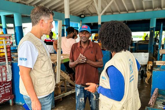 A fisherman talks to UN staff